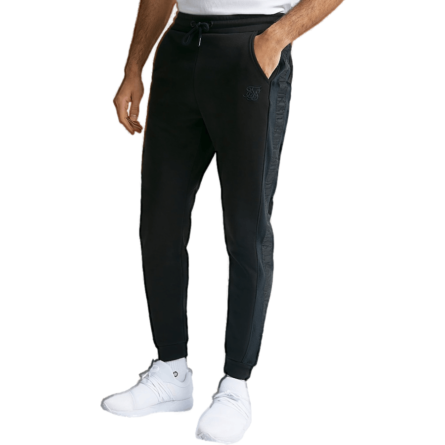 Pantalon noir à revers et bandes opulentes