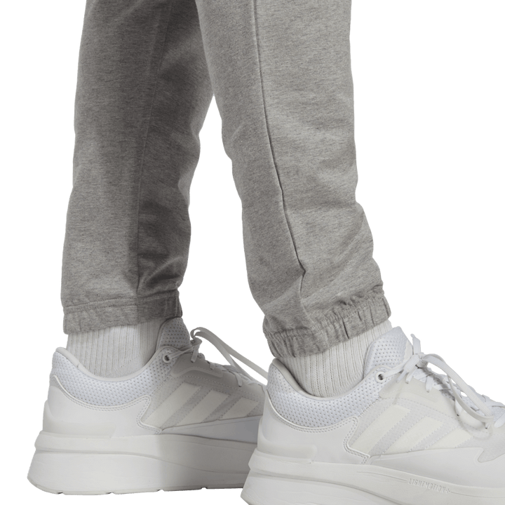 Essentials Enojni džersi s koničastim trakom Badge of Sport Joggers sive barve